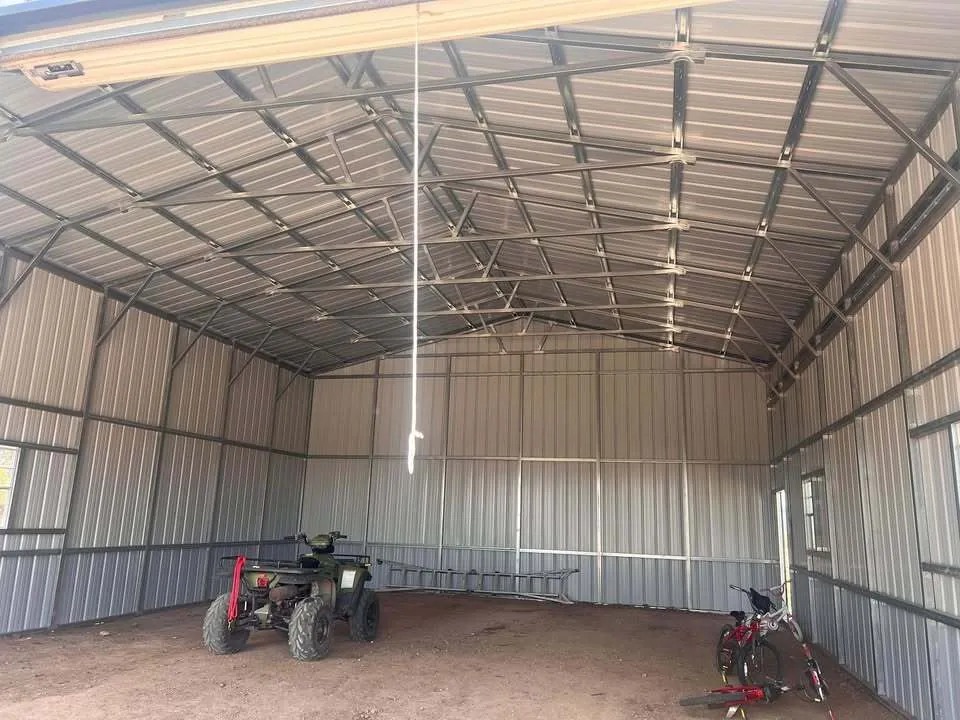 Interior of a 30x40 steel building showing the steel frame, wall panels and an open floor